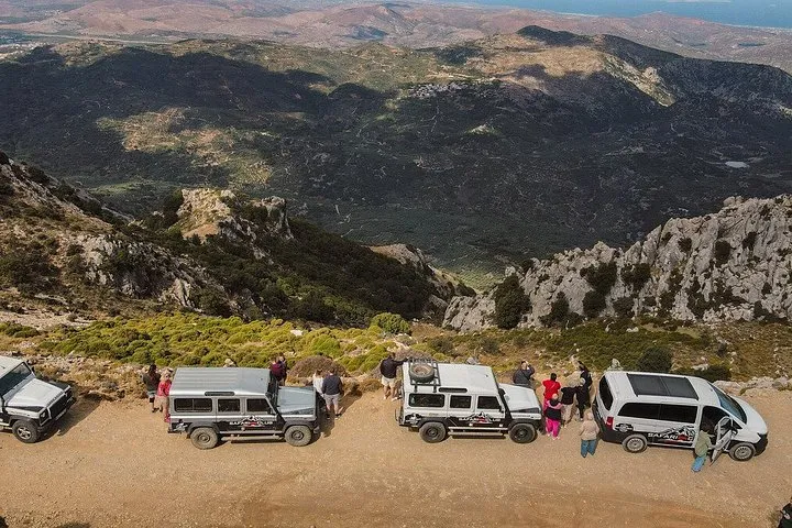 Land Rover on a mountain track above olive groves on a Minoan route safari, Crete Greece