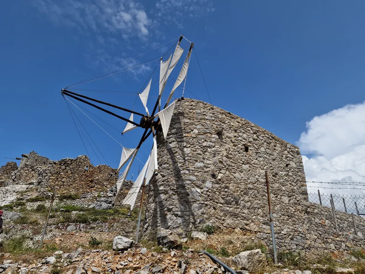 A preserved stone windmill at the Seli Ambelou pass, the northern entrance to the Lasithi Plateau near the Cave of Zeus