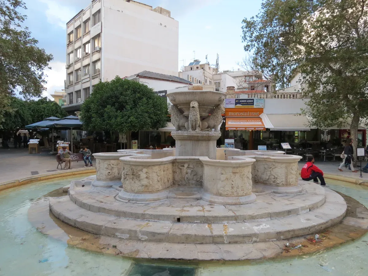 Morozini's Fountain in Lions Square, Heraklion, a central spot to weigh crete costs against a cafe table