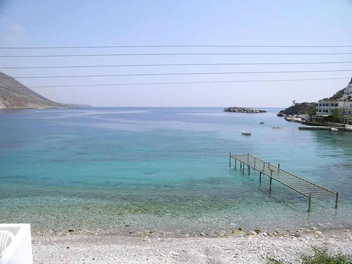 The clear turquoise bay at Loutro with Loutro islet offshore, Sfakia, south coast of Crete
