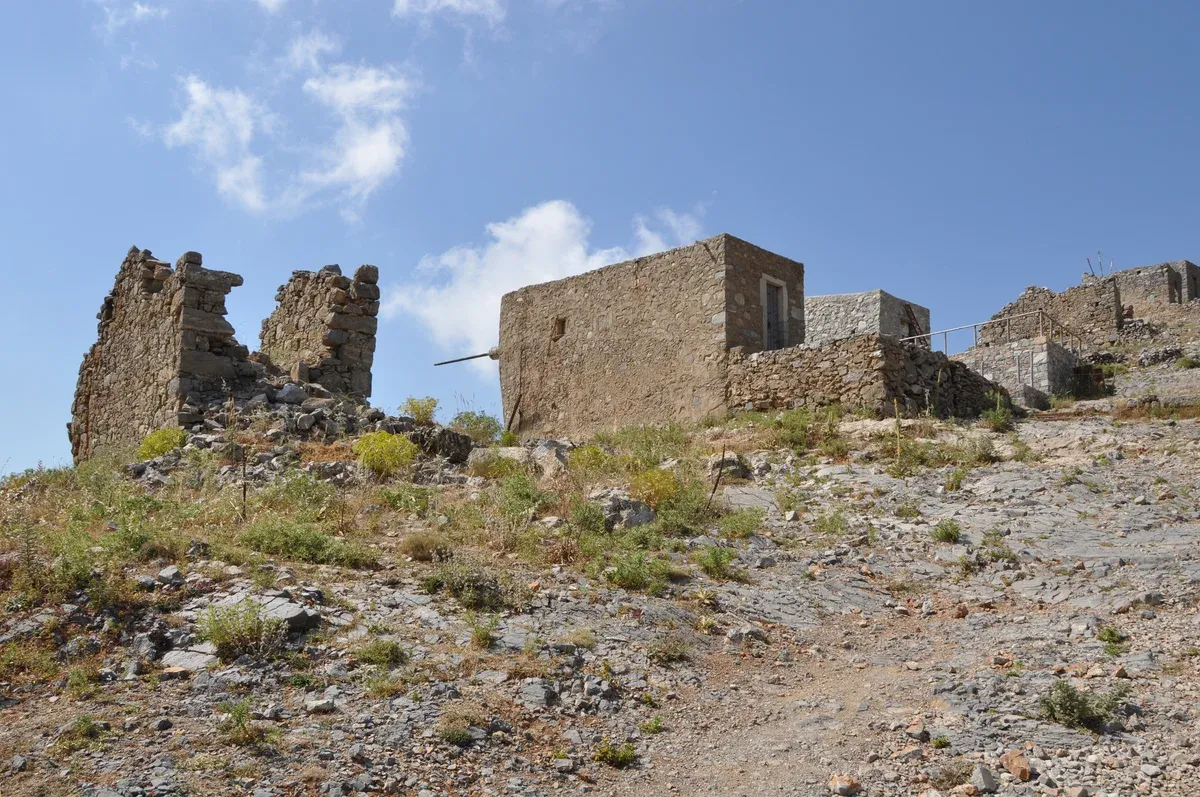 Stone windmill ruins on the Lasithi Plateau, part of a crete travel tips route inland