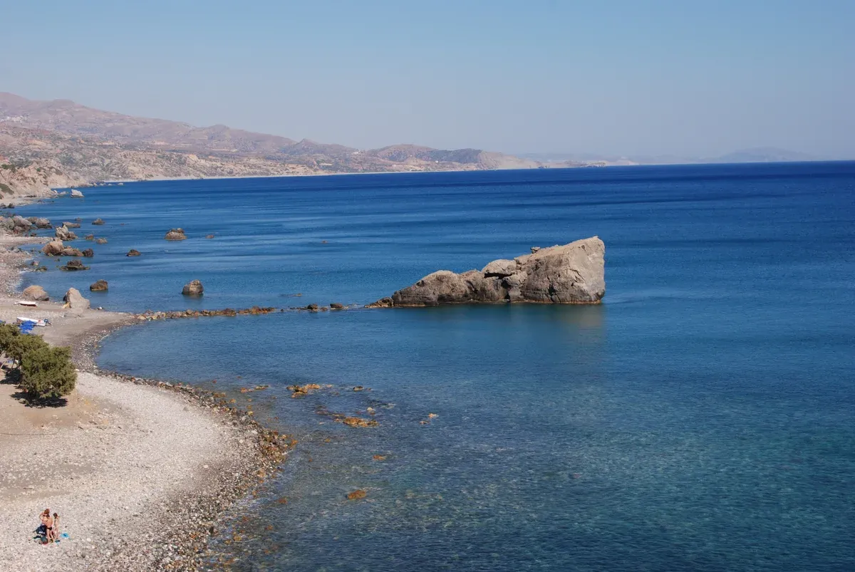 The blue water and pebble shoreline of Preveli beach on Crete's south coast