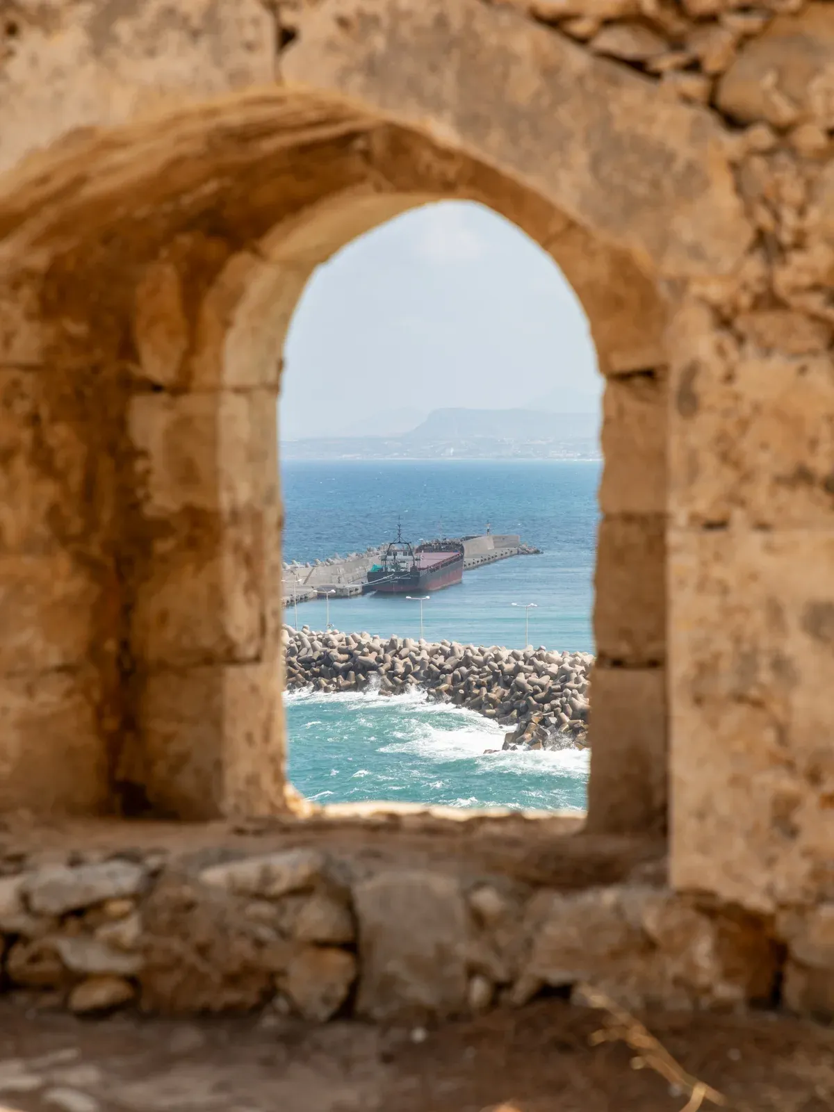 Sea view through a gun port on the Fortezza parapet, Rethymno, Crete Greece